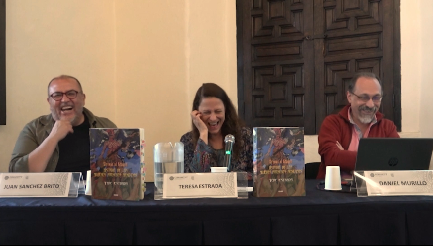 Un grupo de personas sentadas frente a una mesa con una caja de cartón El contenido generado por IA puede ser incorrecto.